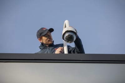 Electronic Security technician working on a PTZ CCTV camera - Securitas UK.jpg